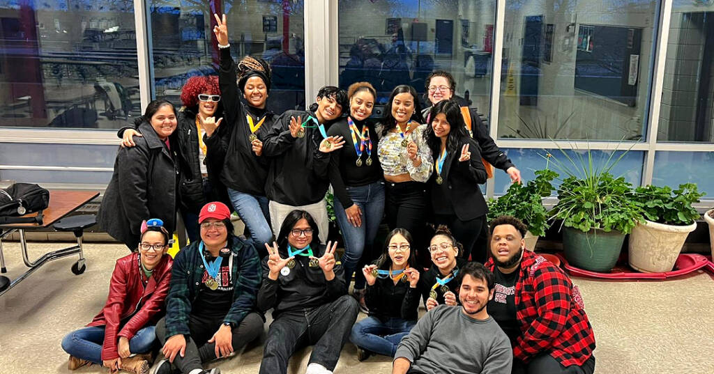 Boston team poses with medals