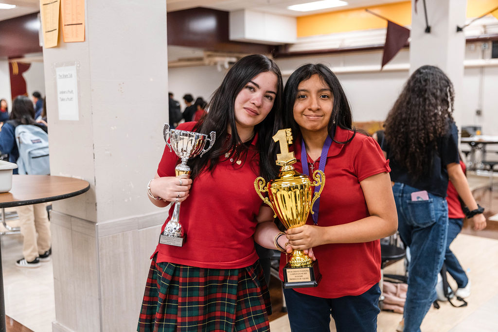 posing with trophies