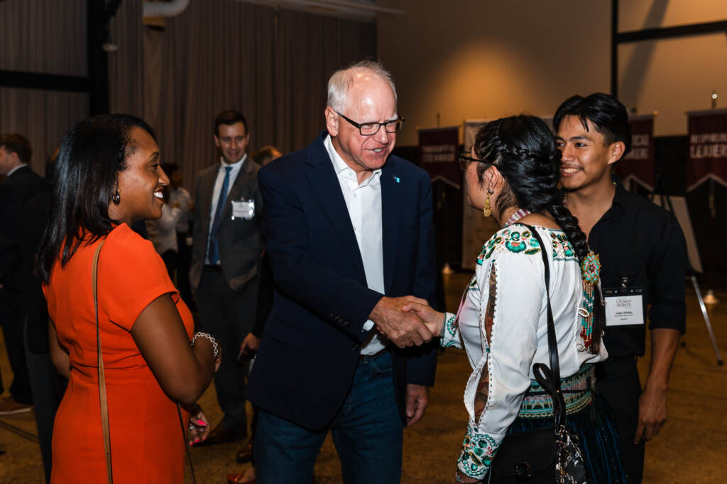 Governor Tim Walz greets members of the Spanish Debate League