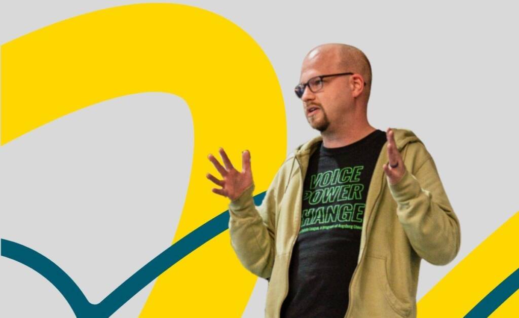 David Quosig speaking with text: 2026 Coach of the Year Finalist