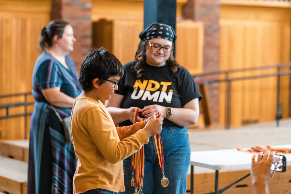 Debater with medal