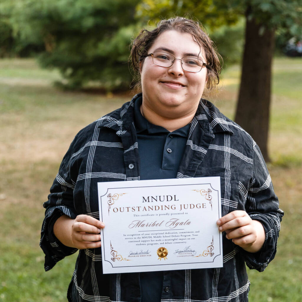 Maribel Ayala smiles with certificate