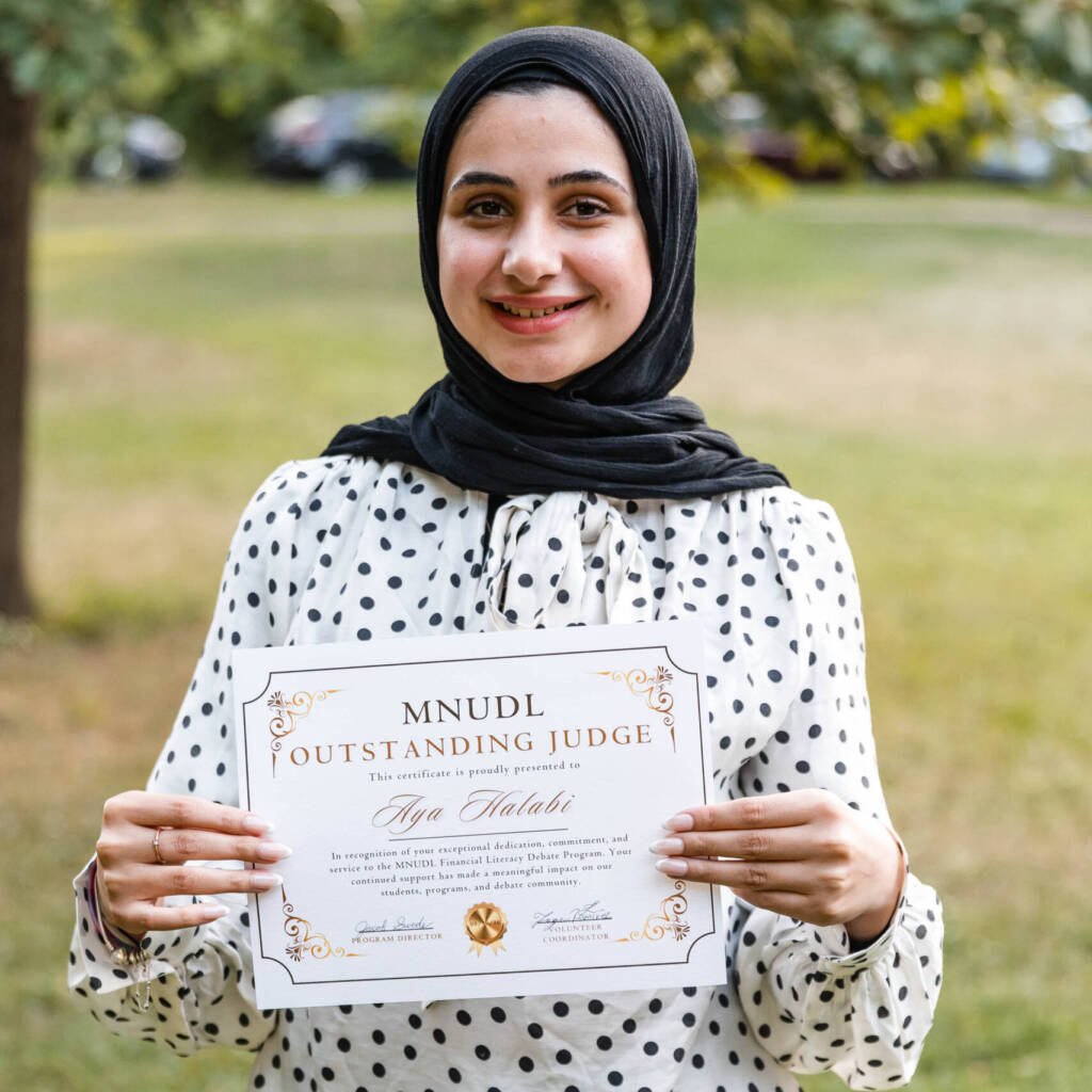 Aya smiling with certificate